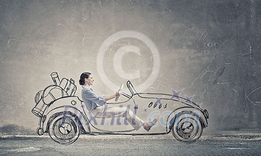 Young humorous woman driving drawn funny car Young humorous woman driving drawn funny car