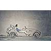 Young humorous woman driving drawn funny car