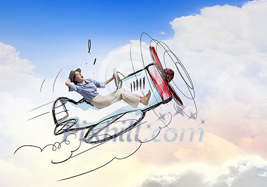 Young funny woman flying in air in drawn airplane Young funny woman flying in air in drawn airplane