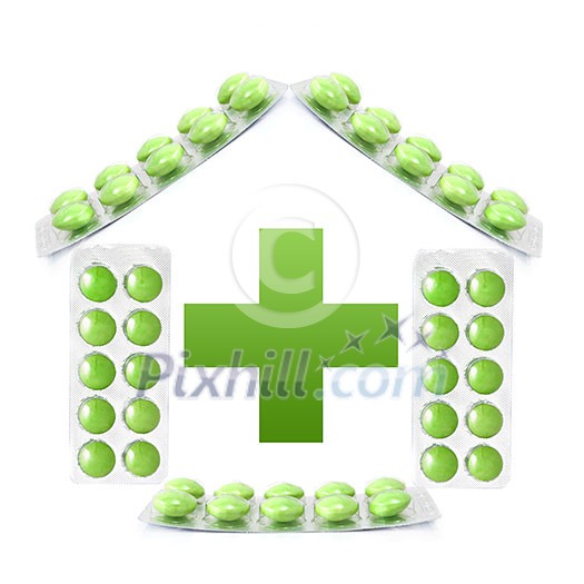House from packs of green tablets and cross isolated on white House from packs of green tablets and cross isolated on white