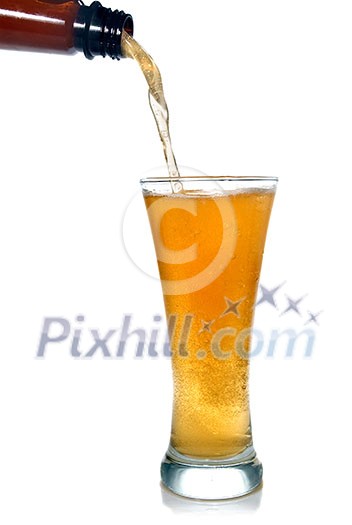 Beer pouring from bottle into glass isolated on white Beer pouring from bottle into glass isolated on white