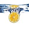 Fresh lemon dropped into water with bubbles isolated on white