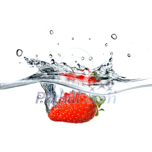 Fresh strawberry dropped into blue water with splash isolated on white