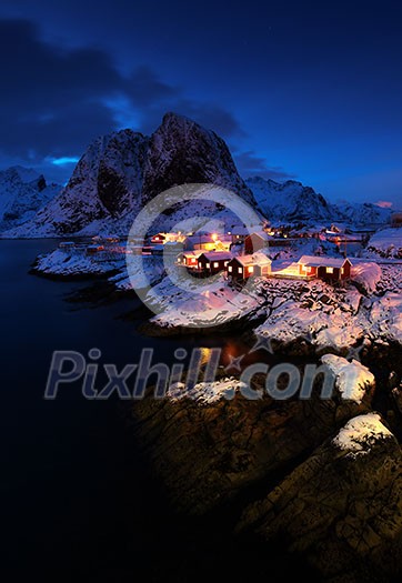 Hamnoy village in Lofoten islands of Norway in winter time. Night on Lofoten. Hamnoy village in Lofoten islands of Norway in winter time. Night on Lofoten.