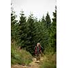 Active senior hiking in high mountains - enjoying his retirement in an active way
