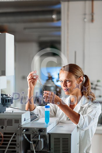 Portrait of a female researcher doing research in a lab, using a tablet computer for data collection and visualization(shallow DOF; color toned image) Portrait of a female researcher doing research in a lab, using a tablet computer for data collection and visualization(shallow DOF; color toned image)