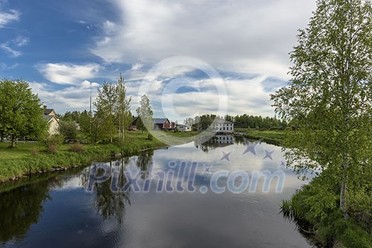 Calm river scenery in nordic countryside Calm river scenery in nordic countryside