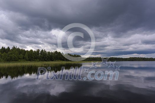 Dark rain clouds over water Dark rain clouds over water