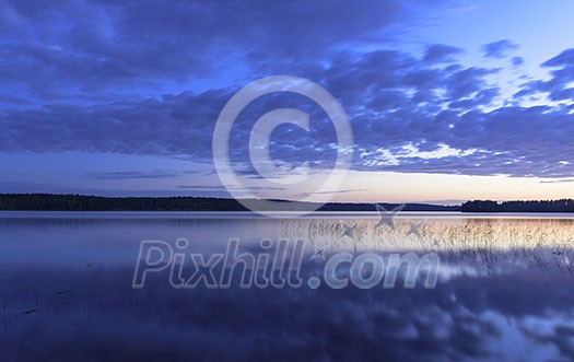 Colorful lake scenery in summer night Colorful lake scenery in summer night