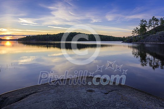 Sunset on a rocky lake Sunset on a rocky lake