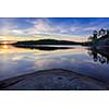 Sunset on a rocky lake