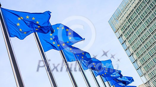 European Union flags in front of the Berlaymont building in Brussels, Belgium.