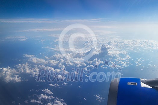Clouds and sky as seen through window of an aircraft, Clouds and sky as seen through window of an aircraft,