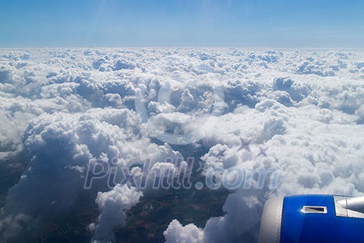 airplane's wing over a blue and cloudy sky airplane's wing over a blue and cloudy sky
