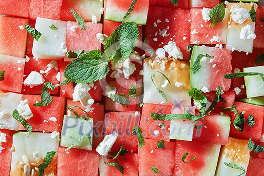 Background of watermelon slices, feta cheese and mint Background of watermelon slices, feta cheese and mint