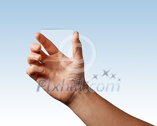 man's hand represents a transparent glass on a blue background place for text man's hand represents a transparent glass on a blue background place for text