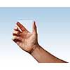 man's hand represents a transparent glass on a blue background place for text
