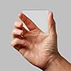 closeup of a transparent glass in a man's hands on a gray background copy space for text