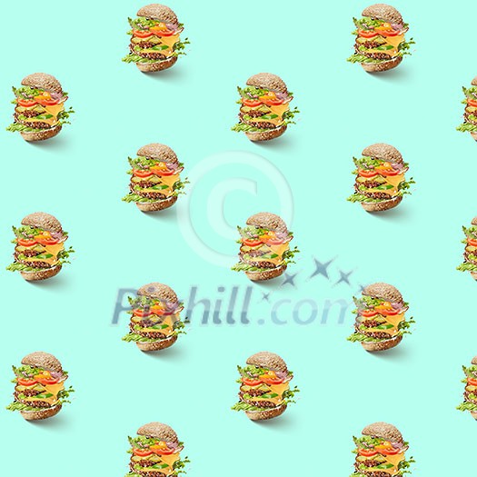 pattern of flying hamburger with vegetables and cheese on a green background pattern of flying hamburger with vegetables and cheese on a green background