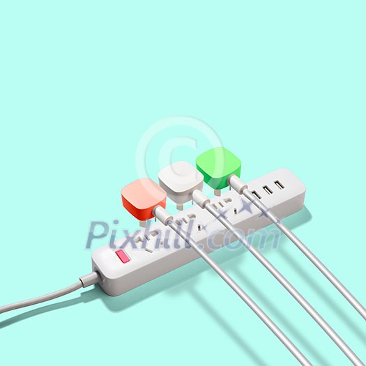 Three electrical plugs connected to a power strip or extension strip on a green background Three electrical plugs connected to a power strip or extension strip on a green background