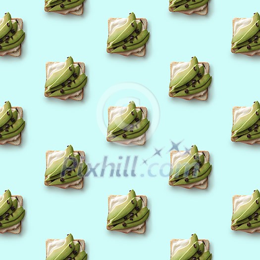 pattern sandwiches with pieces of fresh avocado on a blue background flat lay pattern sandwiches with pieces of fresh avocado on a blue background flat lay