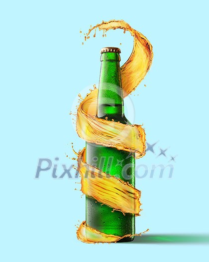 A green beer bottle and a splash around it isolated on a blue background A green beer bottle and a splash around it isolated on a blue background