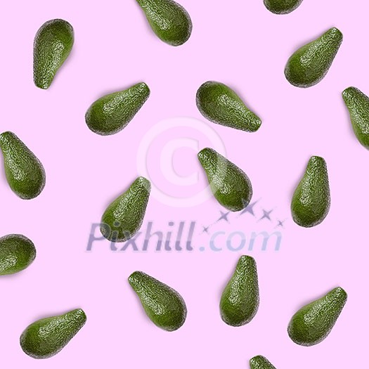 whole green avocado on a pink background flat lay whole green avocado on a pink background flat lay