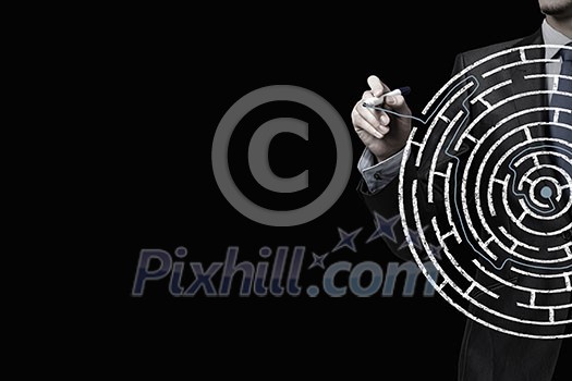 Close up of businessman drawing way out of labyrinth Close up of businessman drawing way out of labyrinth