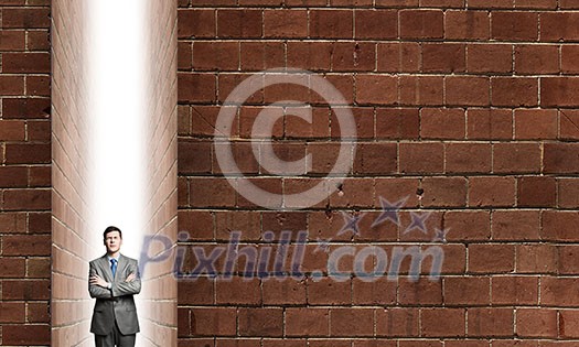 Young confident businessman with hands crossed on chest Young confident businessman with hands crossed on chest