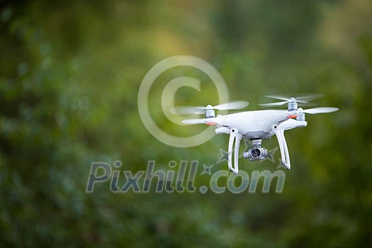 Quadrocopter drone with the camera in flight Quadrocopter drone with the camera in flight