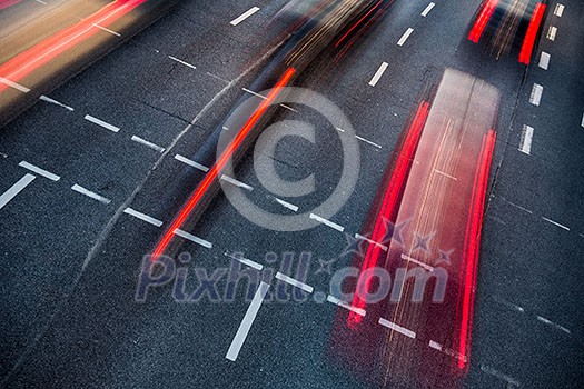 Motion blurred city road traffic (color toned image) Motion blurred city road traffic (color toned image)