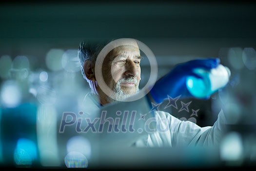 Senior male researcher carrying out scientific research in a lab (shallow DOF; color toned image) Senior male researcher carrying out scientific research in a lab (shallow DOF; color toned image)