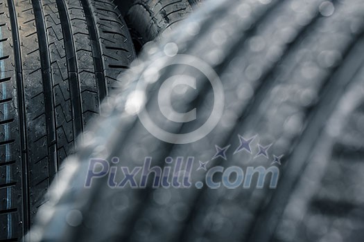 Stack of brand new high performance car tires on clean high-key white studio background Stack of brand new high performance car tires on clean high-key white studio background