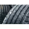 Stack of brand new high performance car tires on clean high-key white studio background