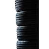 Stack of brand new high performance car tires on clean high-key white studio background