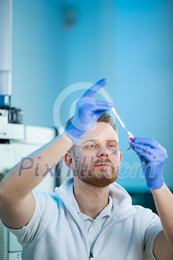 Senior male researcher carrying out scientific research in a lab (shallow DOF; color toned image) Senior male researcher carrying out scientific research in a lab (shallow DOF; color toned image)