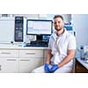 Senior male researcher carrying out scientific research in a lab (shallow DOF; color toned image)