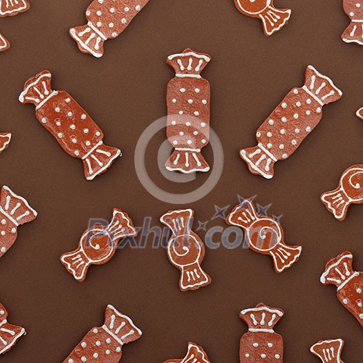 Christmas homemade gingerbread house cookies on a brown background. Christmas card Christmas homemade gingerbread house cookies on a brown background. Christmas card