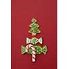 Christmas card with Christmas tree from ginger biscuits on a red background