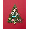 Christmas cookies decorated Christmas tree on a red background. Postcard Happy New Year.
