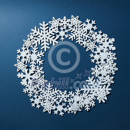Blue background with round space for text and snowflakes. Can be used as greeting card for Christmas and new year Blue background with round space for text and snowflakes. Can be used as greeting card for Christmas and new year