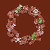 Round frame of homemade gingerbread cookies on a brown background