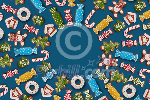 Christmas card from the frame of the ginger cookies on a blue background Christmas card from the frame of the ginger cookies on a blue background