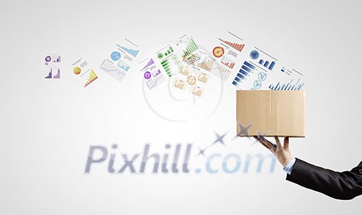 Man holding carton box with graphs and diagrams flying out Man holding carton box with graphs and diagrams flying out