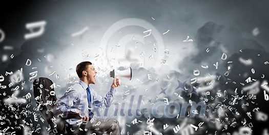 Young angry businessman sitting on chair and screaming in megaphone Young angry businessman sitting on chair and screaming in megaphone