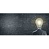 Idea concept with businessman and light bulb instead of his head