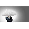 Businesswoman standing with cloud instead of head