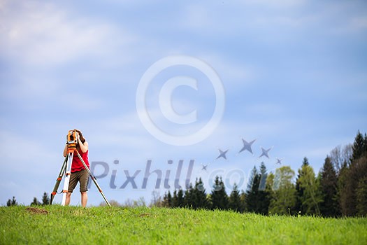 Young land surveyor at work Young land surveyor at work