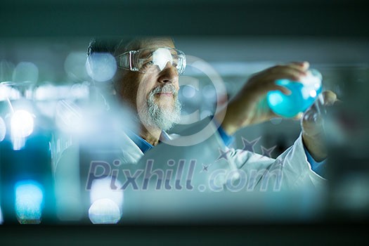Senior male researcher carrying out scientific research in a lab (shallow DOF; color toned image) Senior male researcher carrying out scientific research in a lab (shallow DOF; color toned image)