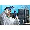 Senior male researcher carrying out scientific research in a lab (shallow DOF; color toned image)